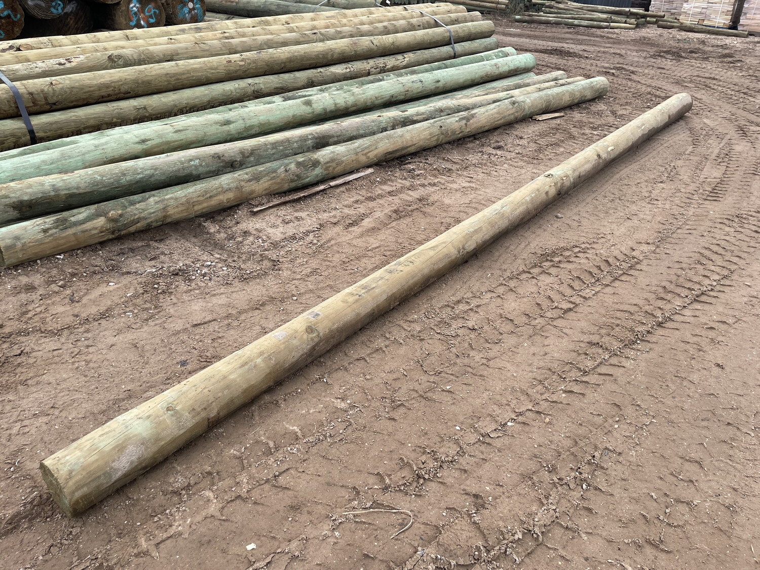 round wooden fence posts