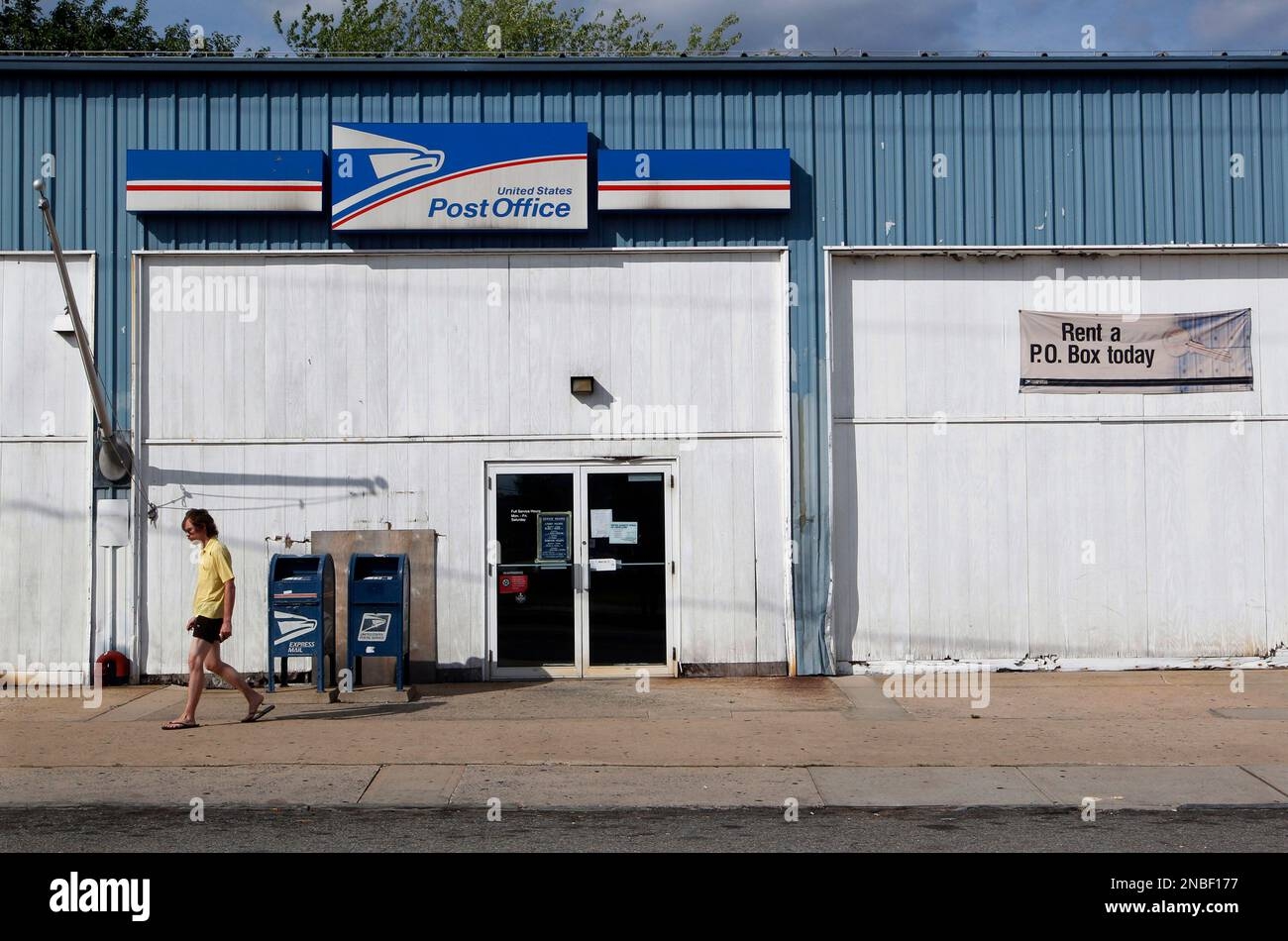 A Man Walk Away From The Handy Street Post Office After Hours Wednesday July 27 2011 In New Brunswick N J The Handy Street Facility Is One Of Fifty Retail Outlets In New