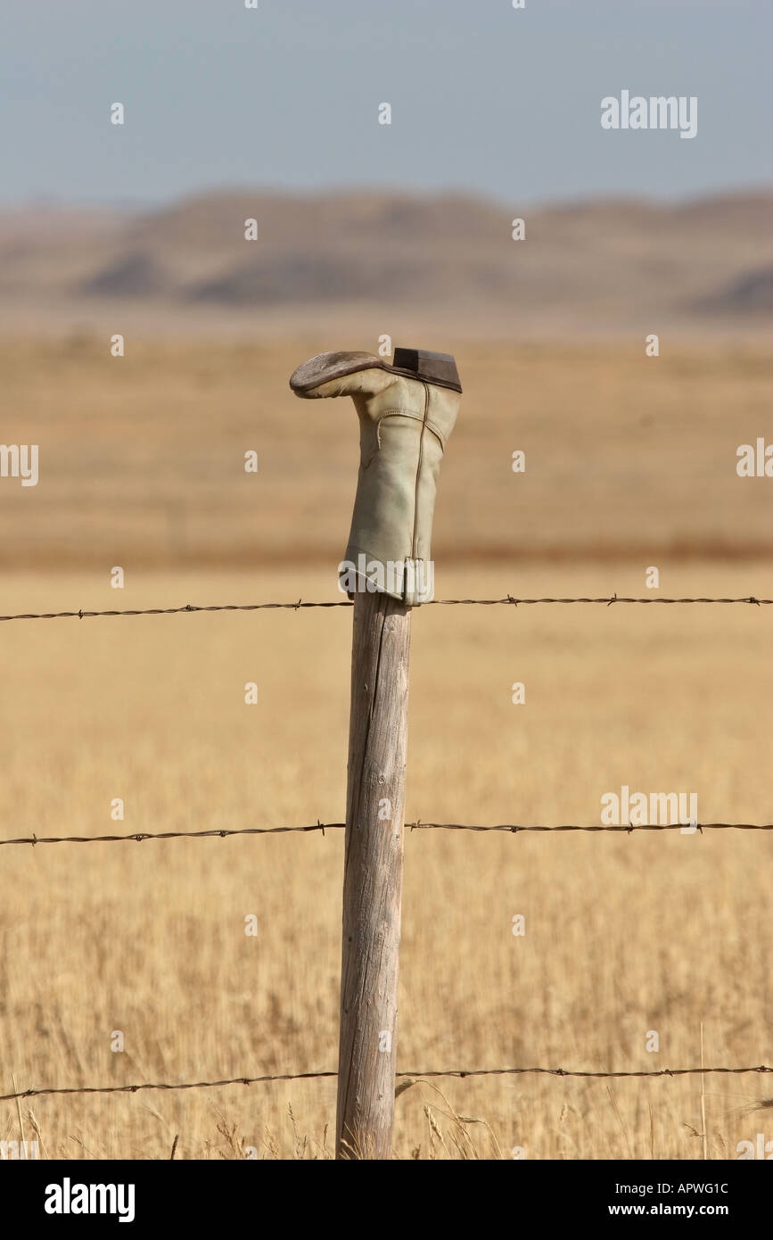 An Old Cowboy Boot On A Fence Post In Scenic Southern Saskatchewan Canada Stock Photo Alamy