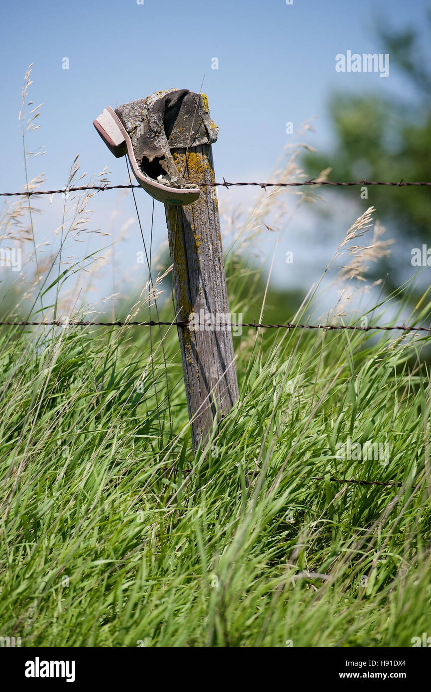 Folk Art Old Cowboy Boot On Fence post In Madison County Iowa USA Stock Photo Alamy