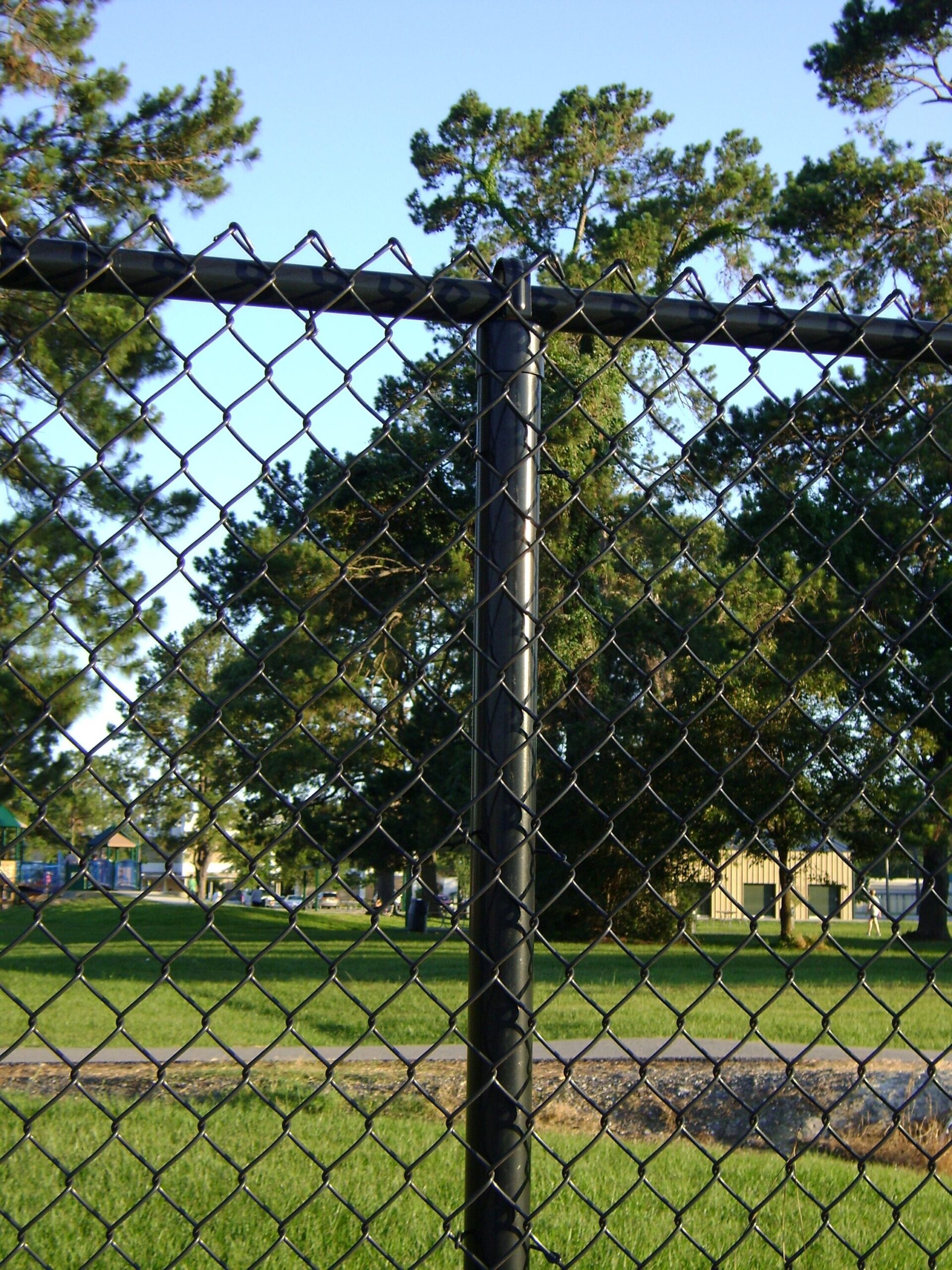 black chain link fence post