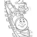 Child choosing colors beside a train-themed page